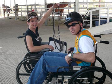 volunteer and student in wheelchairs with bridle