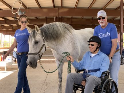 Jenean and Phil help John lead Barbara