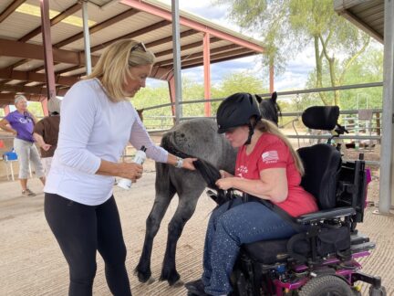Kim helping Katie brush Ashleys tail