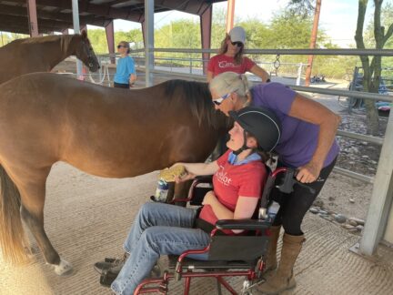Chelsea is assisted brushing Nutmeg