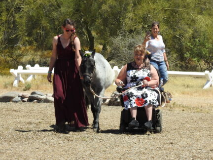 Katie leading Ashley during Hooves & Heroes