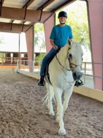 Phil riding Aiden in covered arena